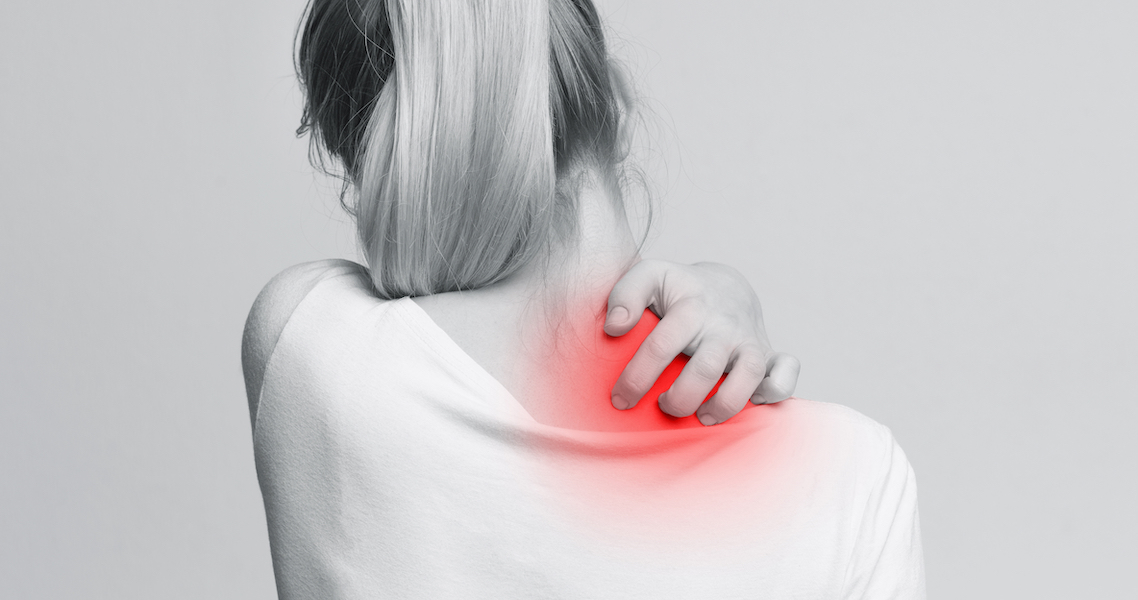 Woman with symptoms of itchy urticaria, scratching her red neck
