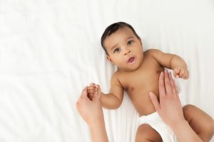 Top View Of Mother And Her Cute Child On White Bed, Space For Te